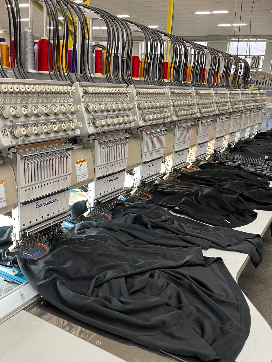 embroidery machine working on shirts