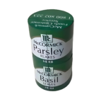 Stacked vertically, two Magic Can Shape containers in green offer a stunning display of flavor. The top is labeled Parsley Flakes and the matching bottom one reads Basil Leaves, both branded as herbs.