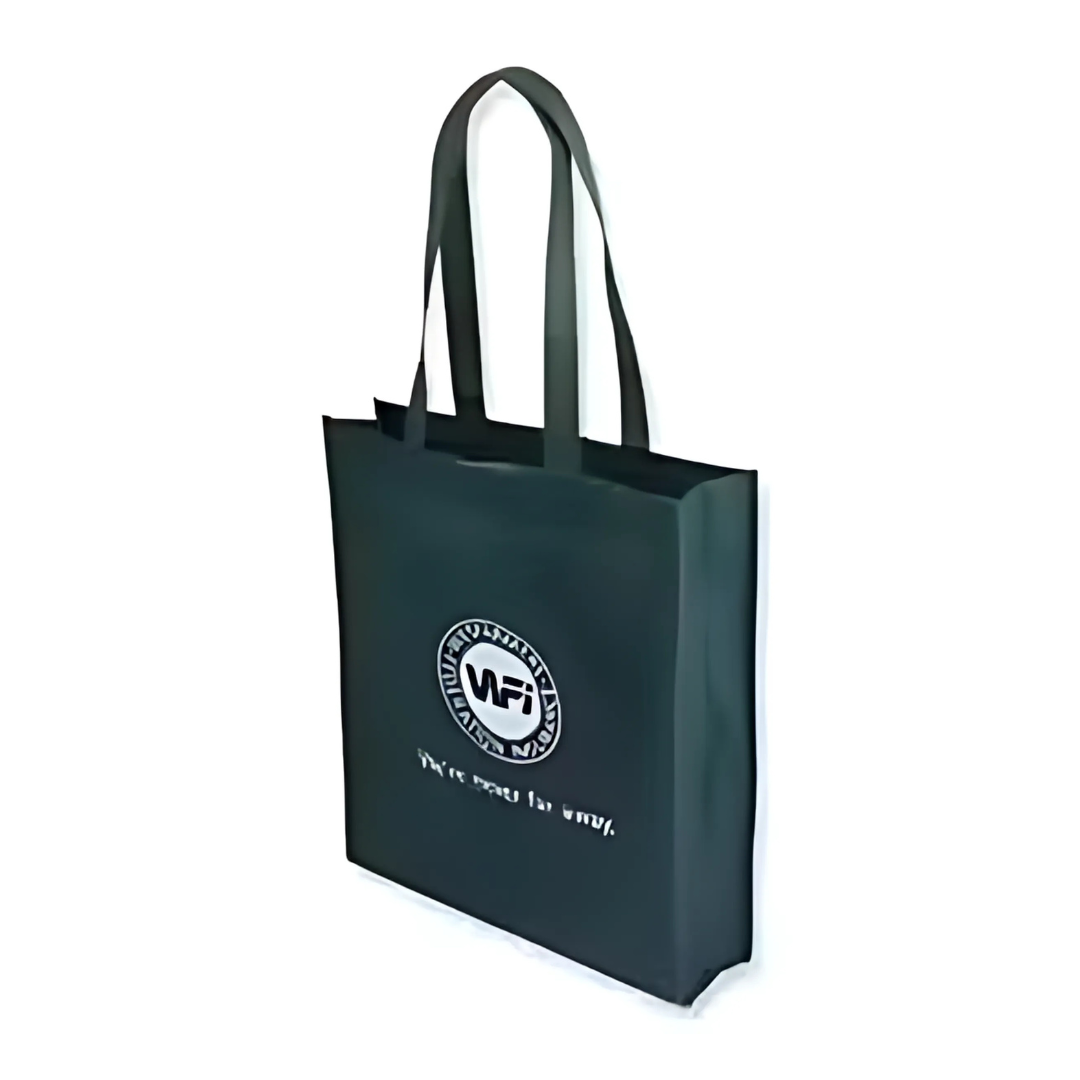 A large Non Woven Bag, 36x41x10cm in black with a smooth texture, showcases a round MFI logo in white. It has two long handles and unclear text under the logo.