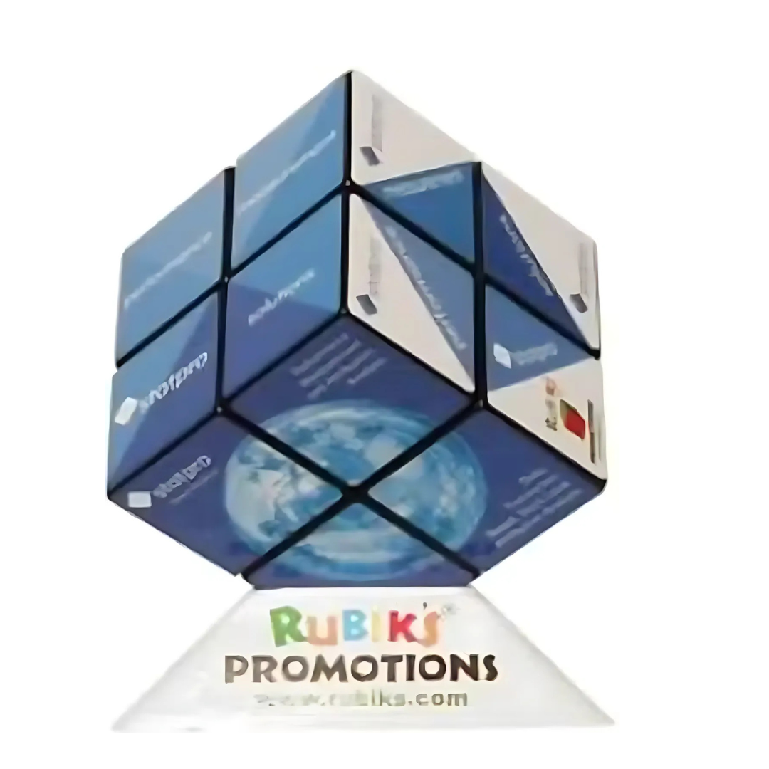 The Rubiks 2x2 Cube, featuring a blue and white color scheme with promotional logos and text, is mounted on a clear stand reading Rubiks Promotions along with a web address, making it an eye-catching brand display piece.