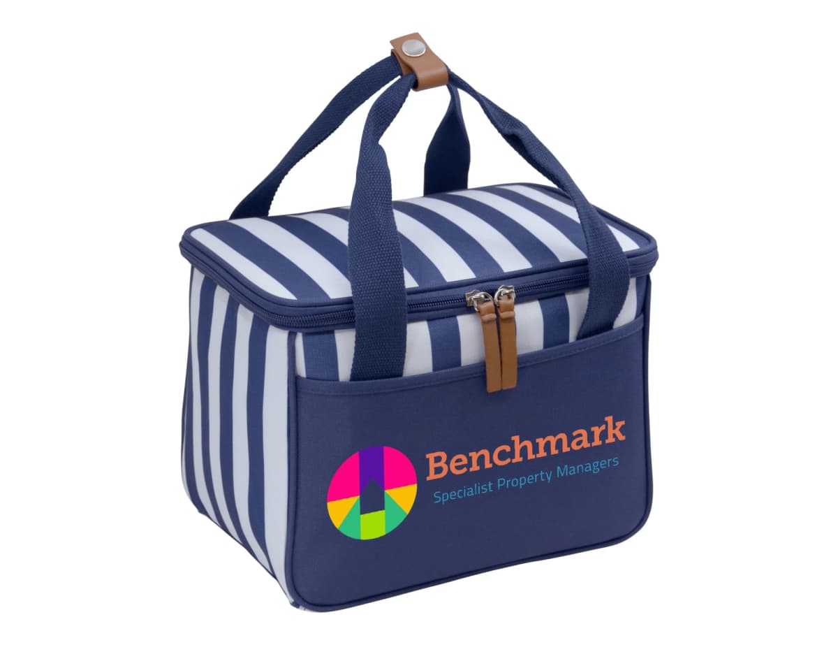 A blue and white striped insulated cooler bag with navy blue handles and a front pocket. The bag features a colorful circular logo and the text Benchmark Specialist Property Managers on the front.
