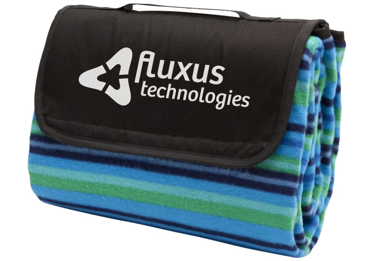 A folded picnic blanket with a blue, green, and black striped design. The flap features the Fluxus Technologies logo in white.
