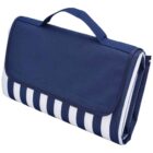 A folded portable picnic blanket with a navy blue flap and a handle. The body of the blanket features white and navy blue stripes.