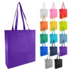 Various colored tote bags displayed; one large purple bag on the left.