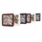 Five QR Code Branded Chocolate squares are lined up diagonally, each featuring a unique QR code and varying in shade from light to dark brown.