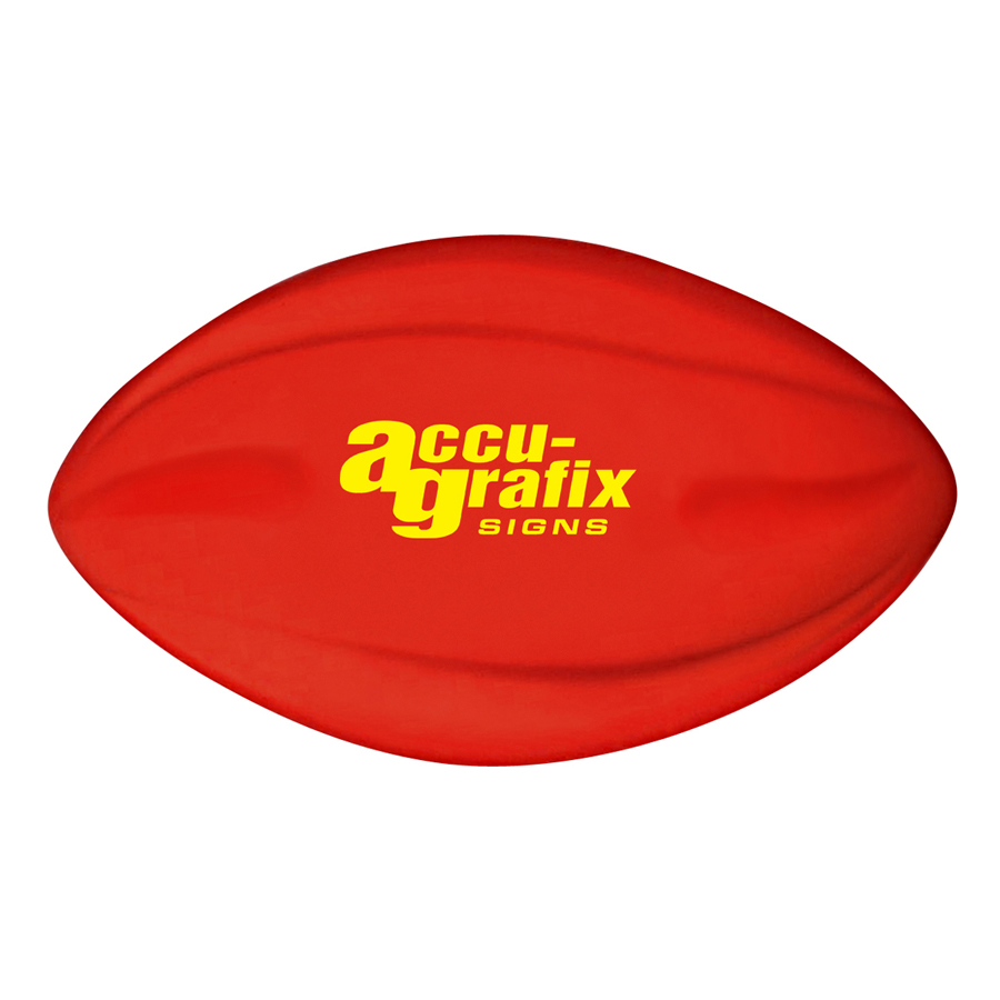 Red football-shaped stress ball with yellow accu-grafix SIGNS logo on it.