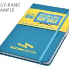 Blue notebook with a yellow belt advertising a sale.