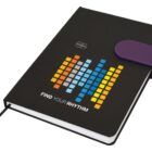 Black notebook with colorful pixel design and Find Your Rhythm text on the cover.
