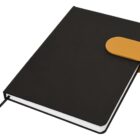 Closed black notebook with a brown clasp and a ribbon bookmark.