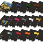 A collection of black notebooks with colorful elastic bands and various logos on the covers.