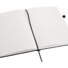Open lined notebook with a black cover and a ribbon bookmark.