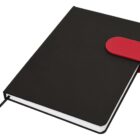 Closed black notebook with a red magnetic clasp on a white background.