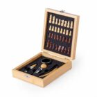 Open wooden box with chess pieces and wine accessories arranged neatly inside.