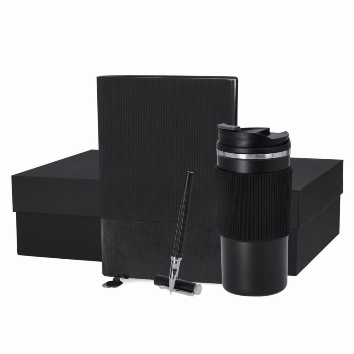 Black travel mug, pen, and notebook in front of a black box.