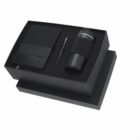 Black gift box with pen, notebook, and thermos inside.