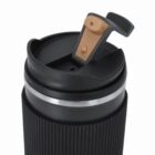 Black and brown travel mug with a closed lid and flip-up sip cover.