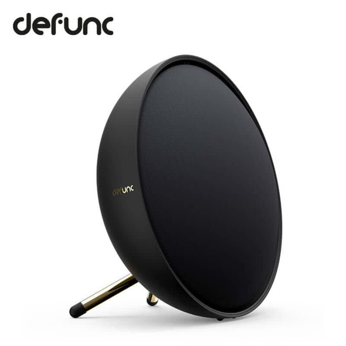 Round black wireless speaker with gold stand and defunc logo on a white background.