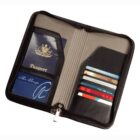 Open travel wallet with passport, cards, and a zippered side.
