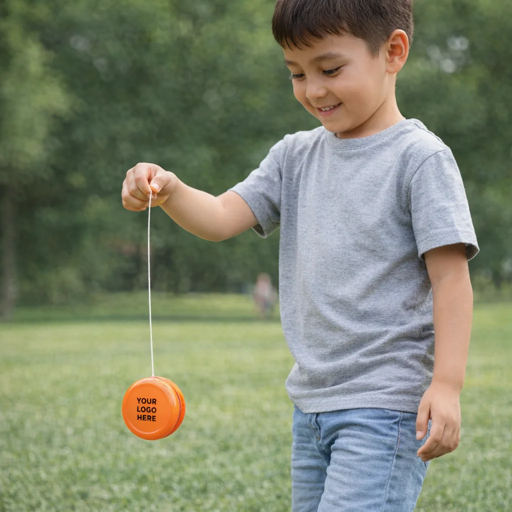 Smiling boy in gray shirt playing outdoors with Yo Yo In Colours.