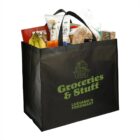 Reusable grocery bag filled with assorted food items, including bread, bananas, and chips.
