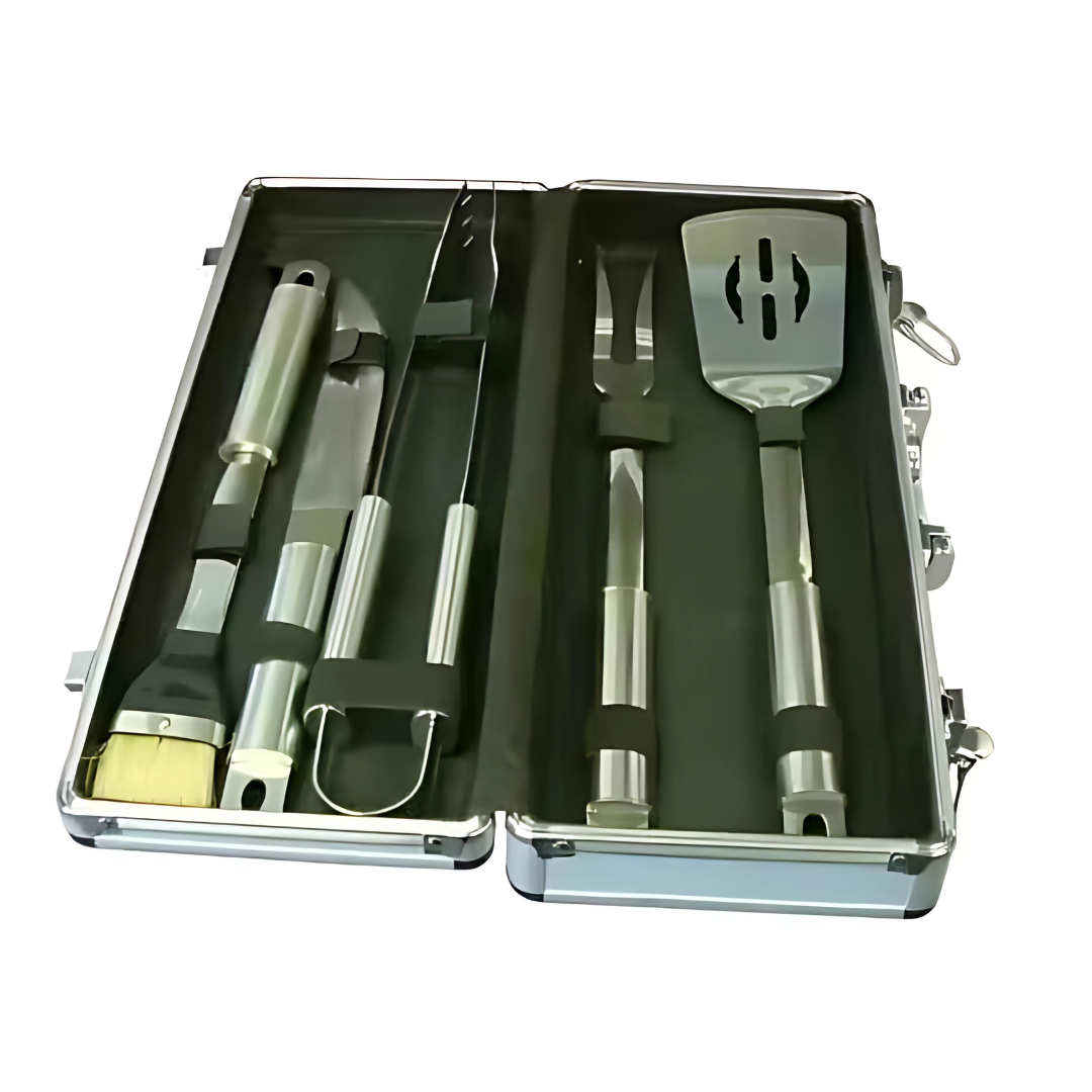 The BBQ Set includes a silver case with barbecue tools like a spatula, fork, tongs, knife, and basting brush. Each tool has metallic handles and is arranged neatly in compartments against a dark interior.