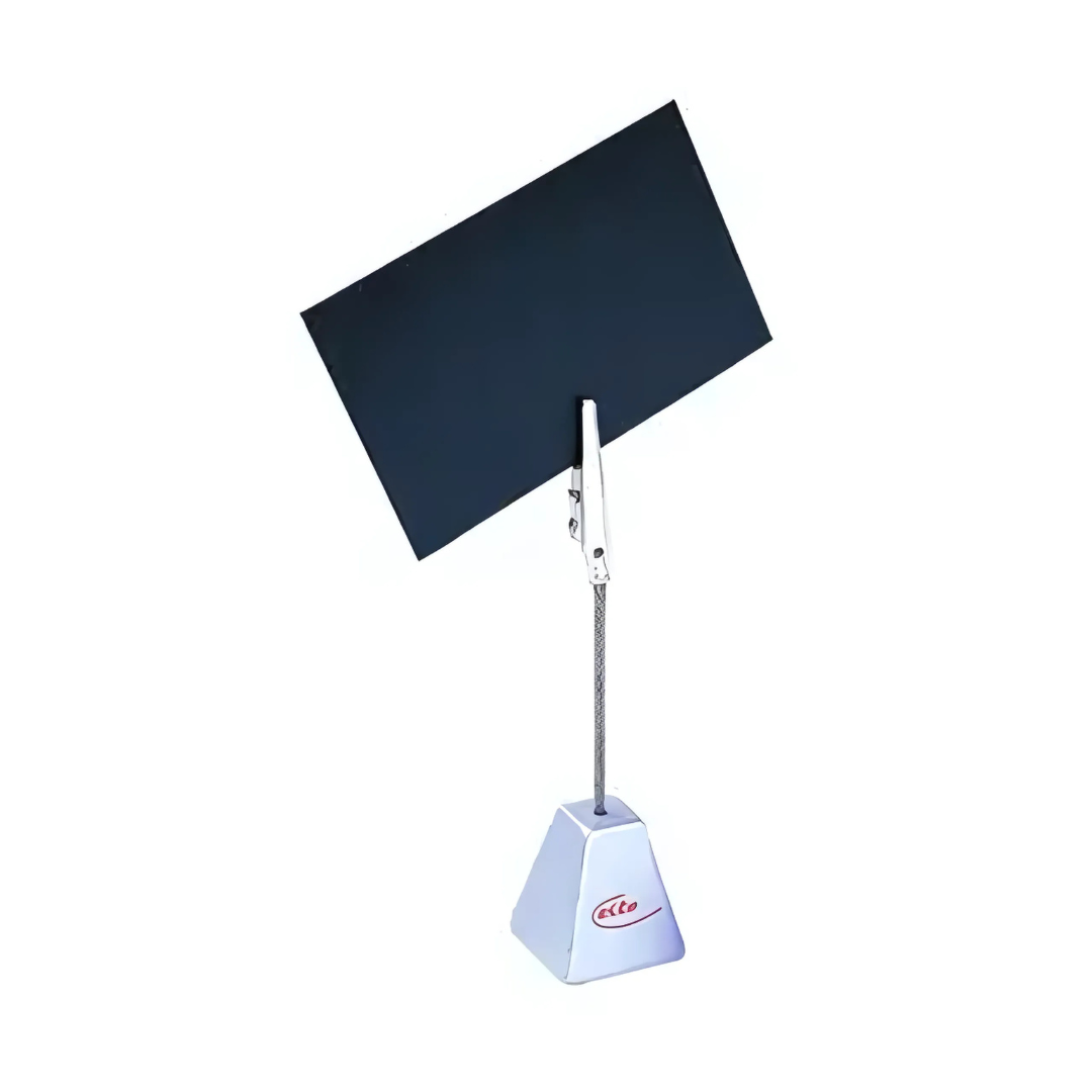 The Branded Memo Holder is a rectangular item with a triangular base, featuring a wire stem and metal clip holding a blank black card. It stands against a white background and displays a distinctive red logo on the base.