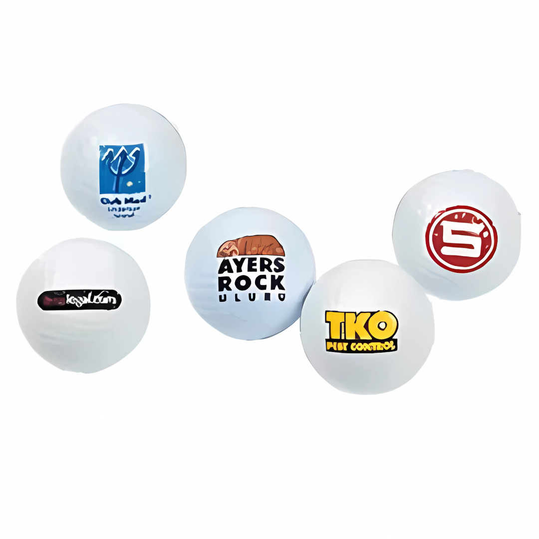 On a white background, five BRIDGESTONE GOLF balls are scattered, featuring diverse logos and text. The Bridgestone Golf logo stands out amidst Ayers Rock, TKO Pest Control, and other unique brand imagery.