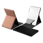 Two foldable travel mirrors, one in rose gold and one in black, shown open and closed.
