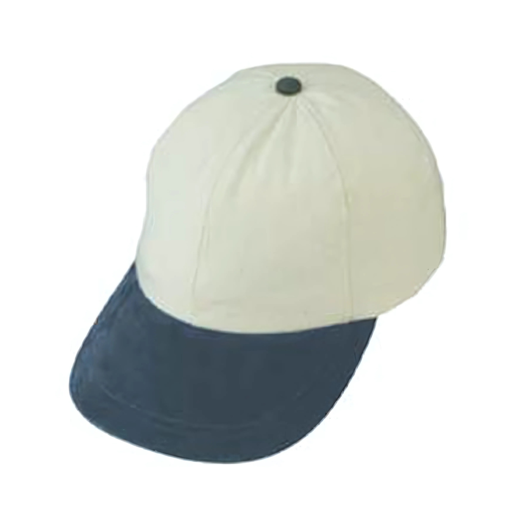 The Cotton canvas 6-panel cap features a cream crown with a dark blue bill, a button on top, and stitching lines extending to the brim, all isolated on a white background.