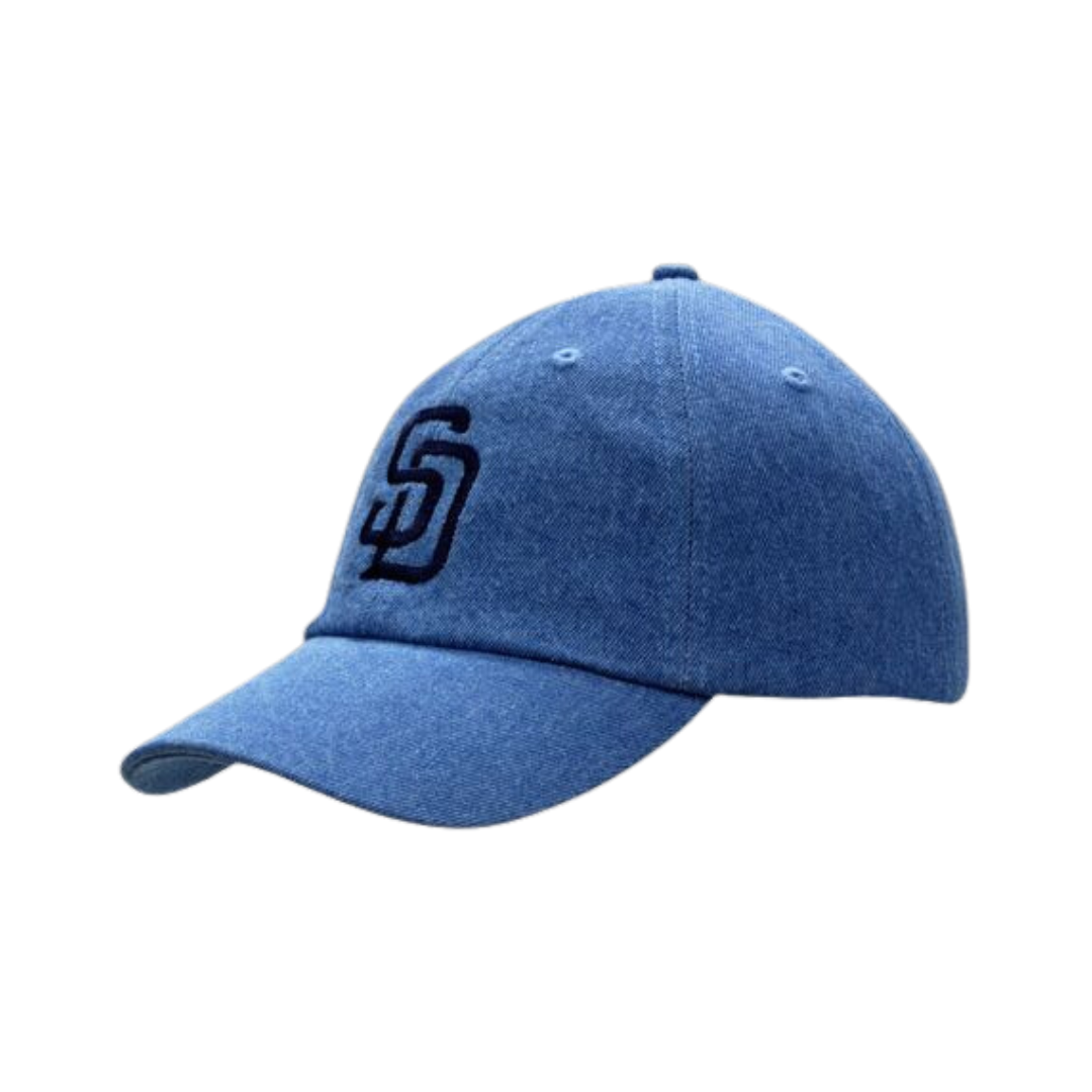 The Cotton denim cap features a blue color with a black embroidered interlocking S and D logo on the front, a curved visor, and six-panel construction.