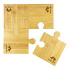 A set of four brown wooden puzzle pieces, one separated from the rest. Each piece features a turtle and the words BLACK SEA engraved on them.