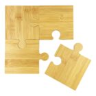 Four wooden puzzle pieces, with one piece slightly separated from the others. The puzzle pieces have a natural wood grain texture and a light brown color.