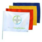 Four Custom Golf Flags are displayed on white poles: the front one is white with a circular logo and Bayer CropScience text, followed by unmarked red, yellow, and blue flags that provide a vibrant touch similar to those seen across golf courses.