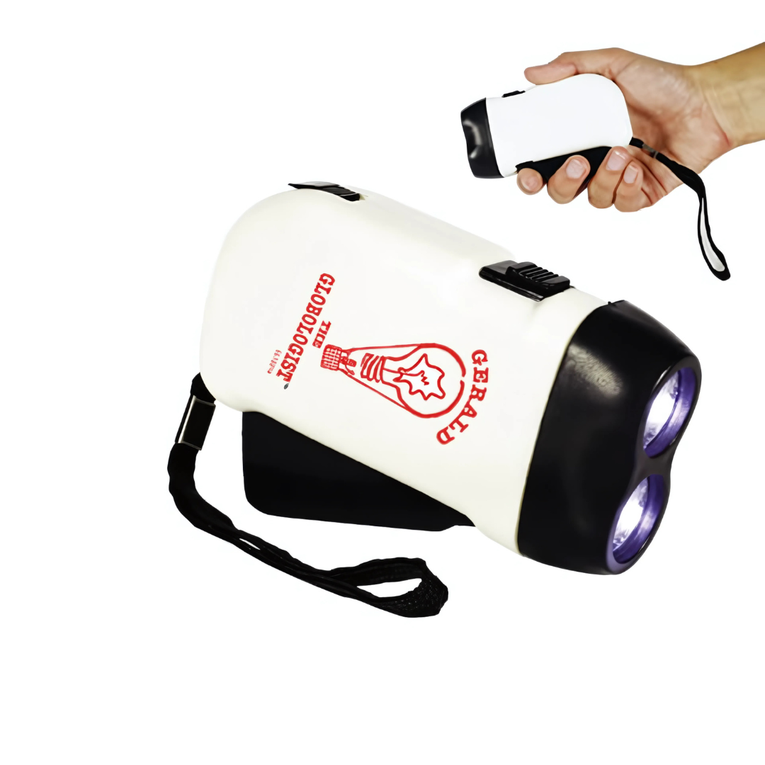 Someone holds a compact Dynamo Flashlight with a black grip and dual LED lights. It generates energy by squeezing and features a red GERALD logo on its white side.