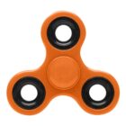 Orange fidget spinner with three black bearings on a white background.