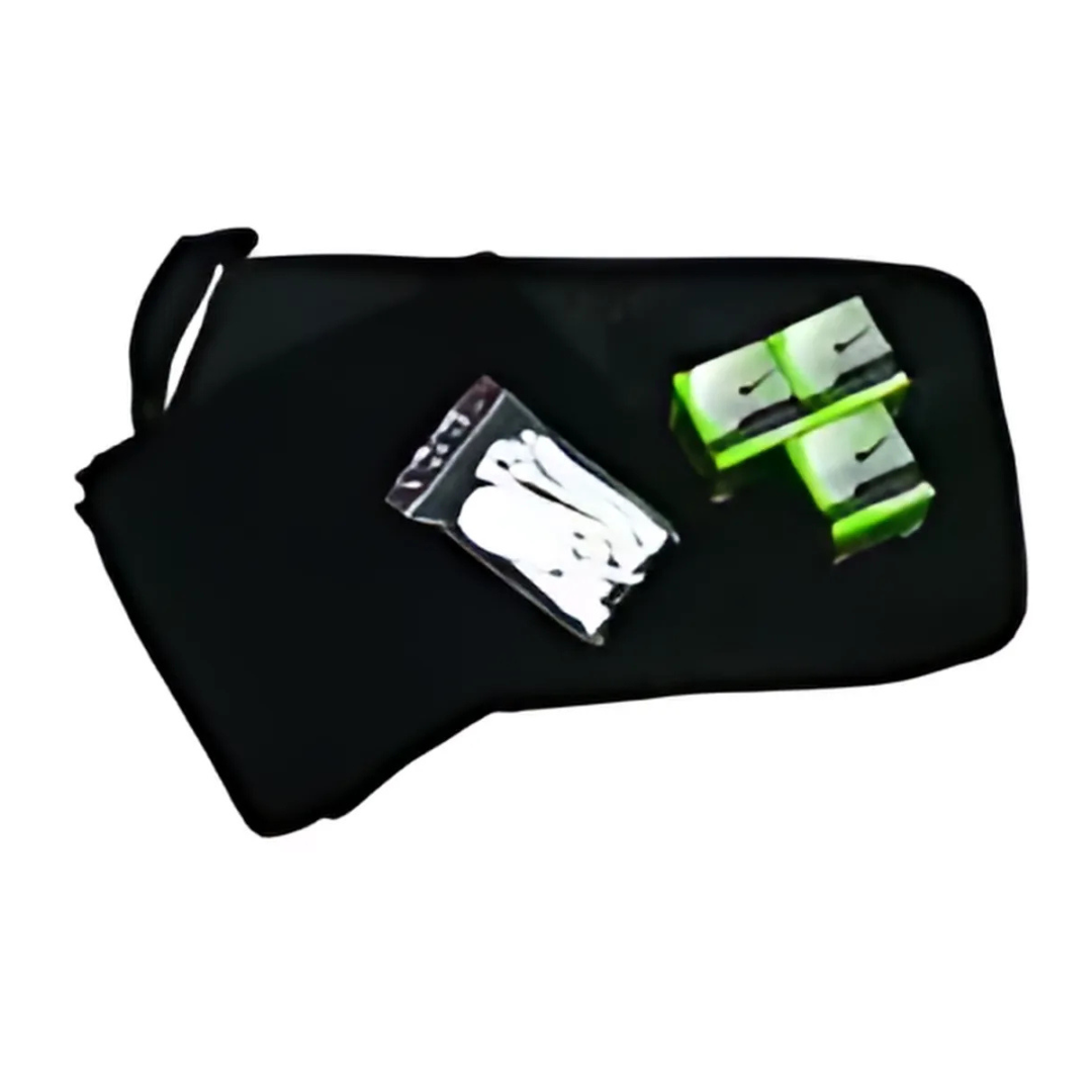 The Golf Day Merchandise Pack includes a black pouch with a zipper handle, containing a clear bag with white shoelaces and two packaged green and white shoe cleaning products, ideal for keeping your footwear pristine.