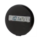 A round black MEDALLION CLOCK displays 10:18 with the date Tuesday, July 4. This modern, sleek design features a clear digital display embedded at its center.
