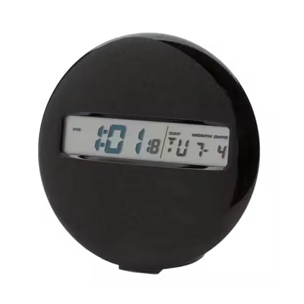 A round black MEDALLION CLOCK displays 10:18 with the date Tuesday, July 4. This modern, sleek design features a clear digital display embedded at its center.