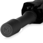 Close-up of a black umbrella handle with an embossed M logo.