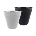 Two ribbed plastic planters are shown: one is white and the other is black. Both have a textured, grooved surface near the top and a smooth finish on the bottom. Theyre positioned side by side on a white background.