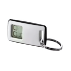 A sleek silver Novelty Promo Keychain Clock with an attached metal ring. The rectangular body features a small digital display, resembling a keychain clock, showing 82.