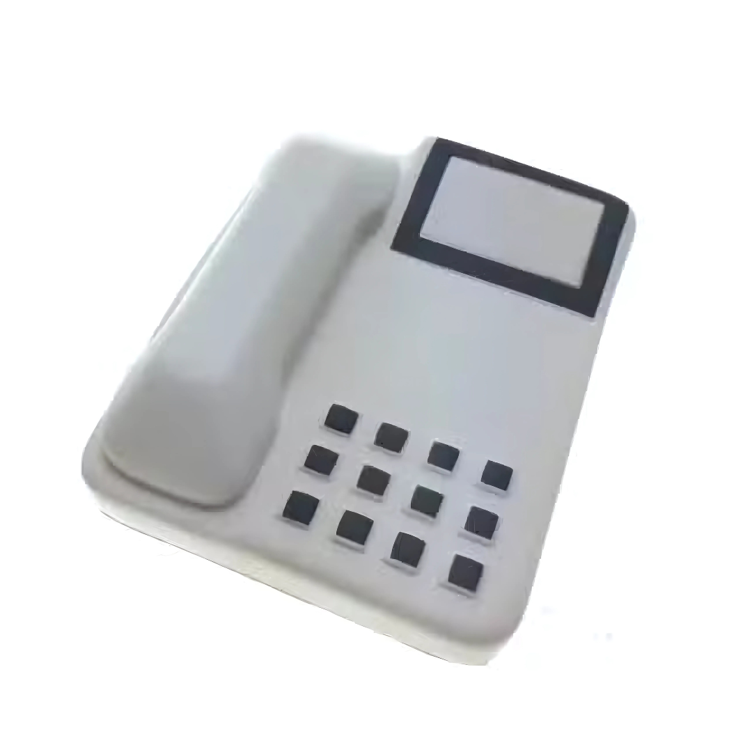 The Stress Ball Telephone is a sleek white office phone with a rectangular digital display and neatly arranged black square buttons on the keypad. Its modern, slightly left-angled design brings calm to a busy workday.