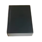 Against a crisp white background, the Stress Shaped Black Book stands tall in its sleek, rectangular form. Its thick, plain black cover is text-free and image-free, inviting curiosity with its minimalist design.