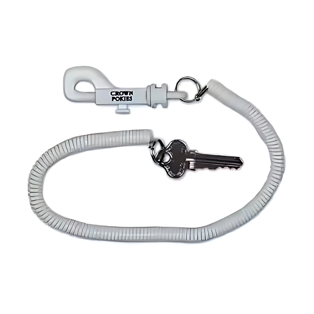 A silver key hangs from a coiled white plastic keychain resembling a telephone cord. The end features a hook similar to the Telephone Cord Promo Keytag, proudly showcasing the printed letters CROWN PORTS.