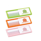 Three pocket-sized Travel Combs w/ Mirror feature sliding covers in green, orange, and pink with the RED CARPET logo. Their neatly aligned white teeth make them ideal stylish travel accessories!.