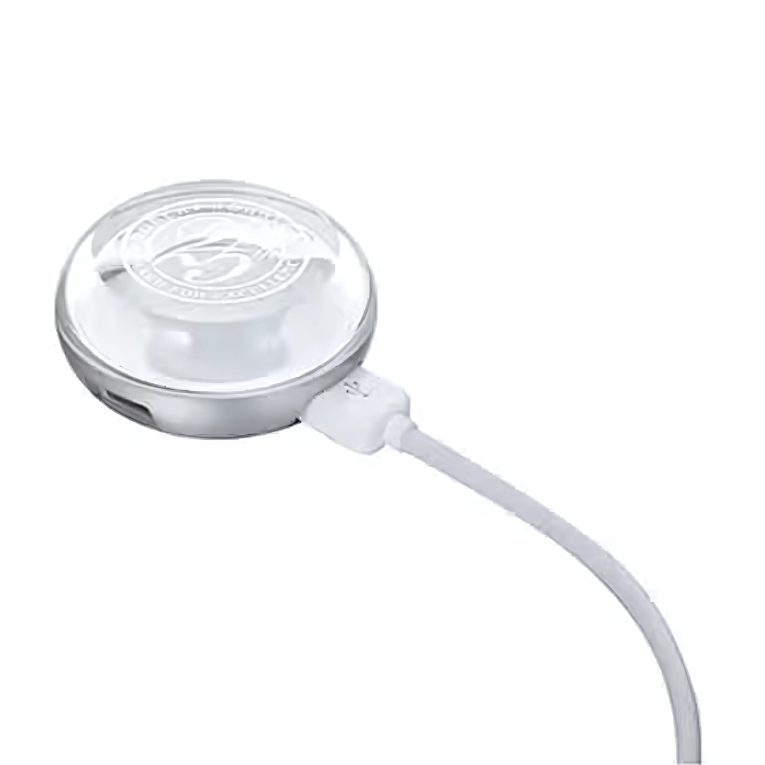 The USB HUB LIGHT is a sleek, round silver device with a transparent top featuring a logo. It connects via a USB cable on the right side and boasts a modern design that seamlessly integrates into any setup.