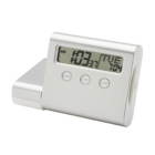 The VOYAGER CLOCK/USB HUB is a sleek silver digital alarm clock displaying 10:31 AM. It features a modern design with three function buttons and an integrated USB hub, set against a clean white background.