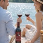 A couple toasts King Valley Pinot Grigio 2008 at a lakeside picnic with cheese and fruit.