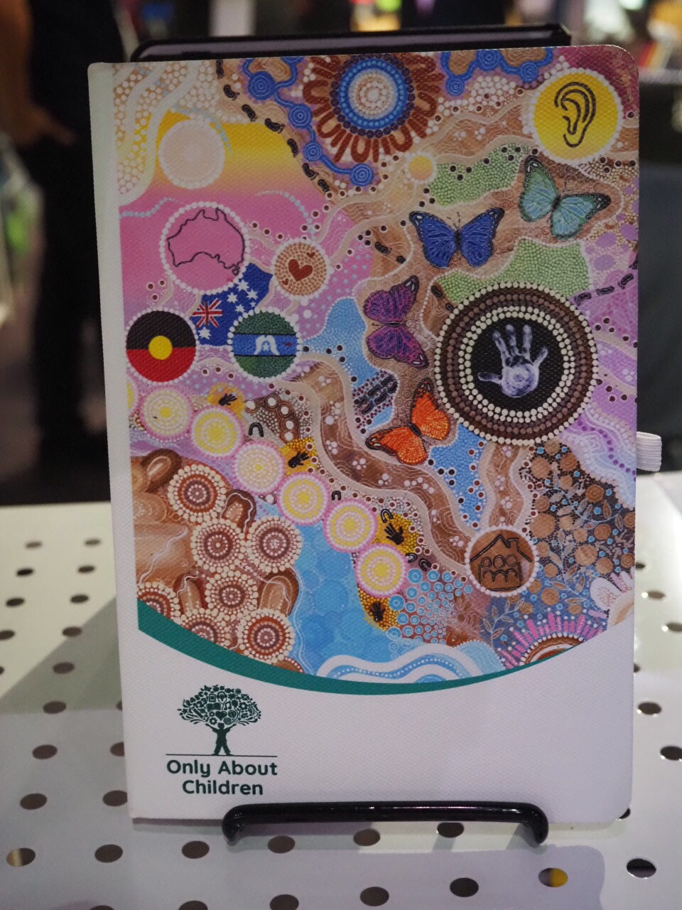 notebook with All About Children logo and graphics