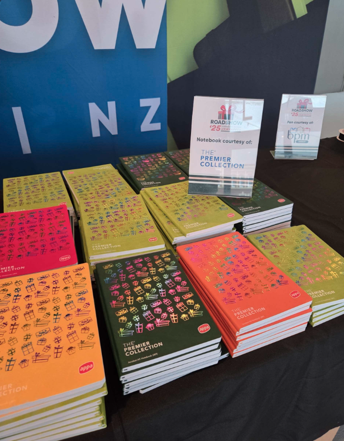 pile of notebooks from premier collection table